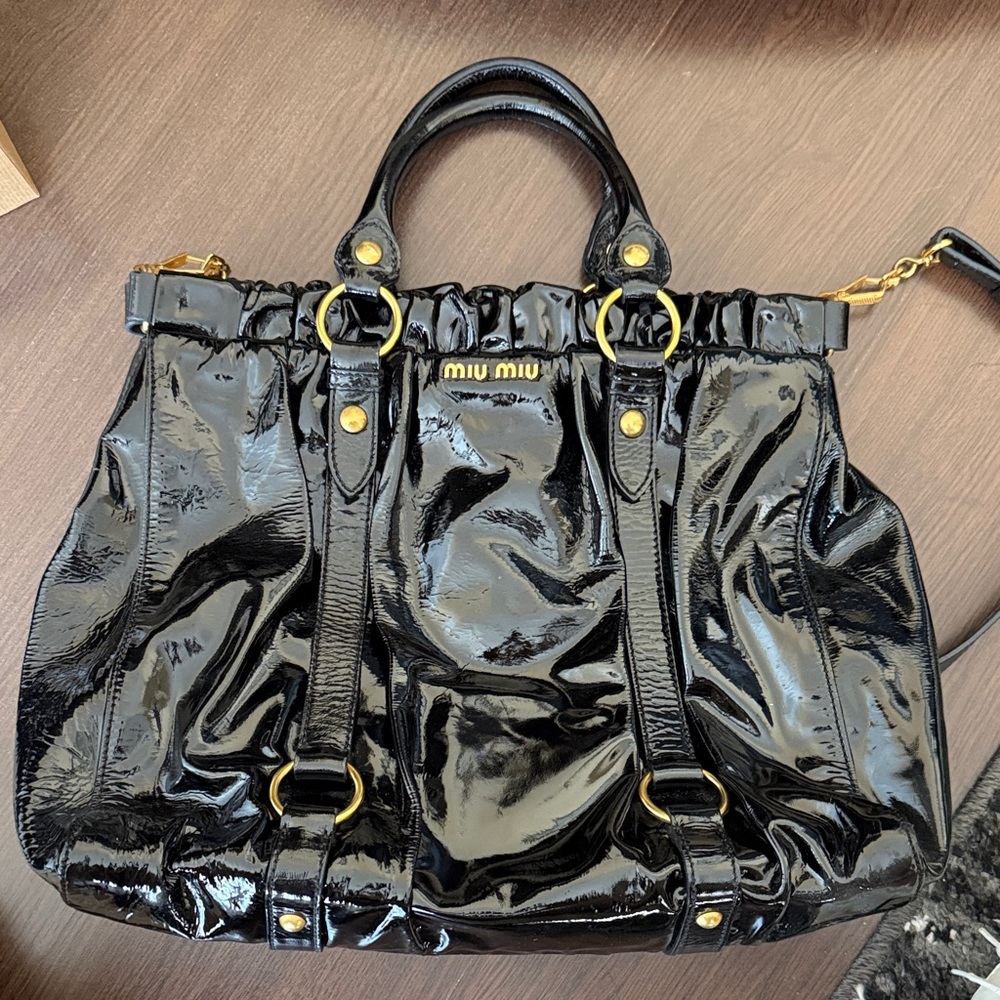 Miu Miu Shiny Black Satchel with Gold Accents